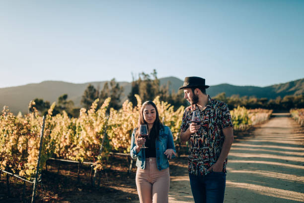 istock Young couple walking on vineyard 1397082815