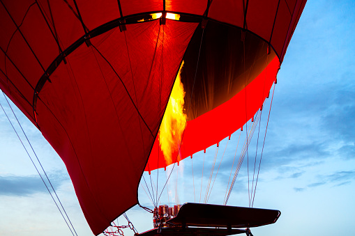 Inflation of hot air balloon for flight preparation in Cappadocia, Turkey.