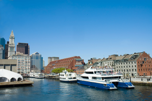 Cruise ships in harbor of St-Charles river, Boston, Mass with people aboard