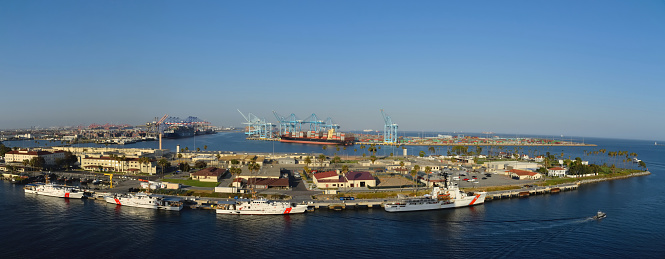 Terminal Island in San Pedro CA panorama with Coast Guard ships and brilliant blue sky
