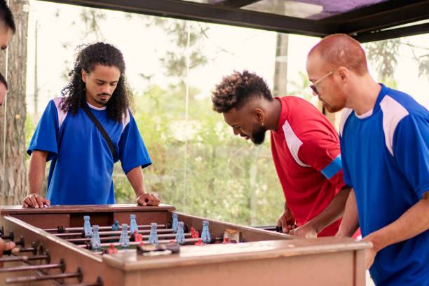 istock Friends playing foosball 1397084973