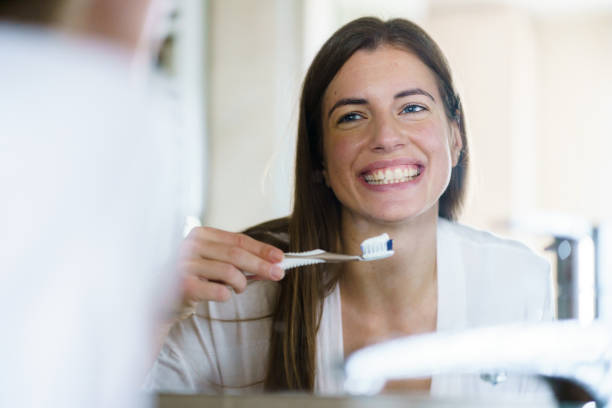 istock Woman is holding a toothbrush 1397085062
