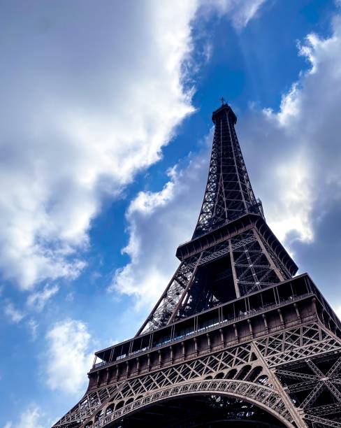 istock Eiffel Tower, Paris, France with blue sky and clouds 1397086286