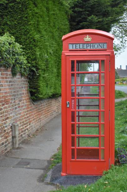 istock Red phone box in village 1397086807