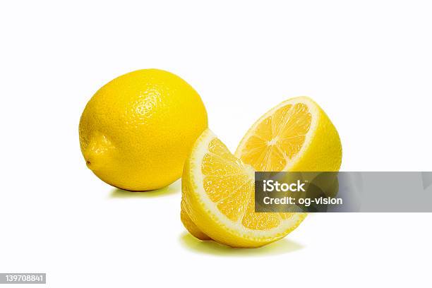 One Full Lemon With Another Half And Quarter Of A Lemon Stock Photo - Download Image Now