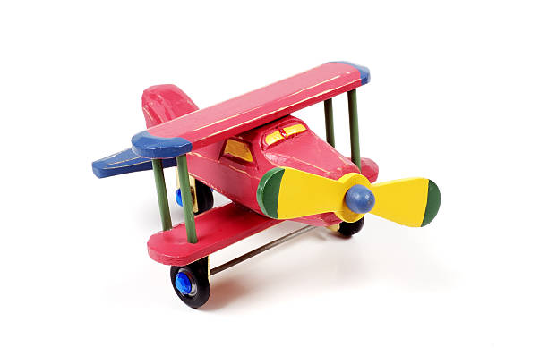 istock Red wooden bi-plane on a white background 139708852
