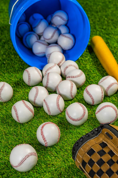 Looking down on a spilled buckets of baseball ready for practice