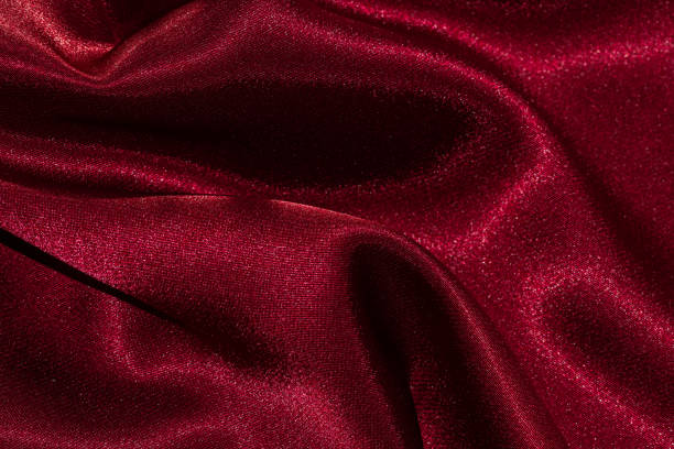 istock Photo of deep dark red draped textile material. 1397088768