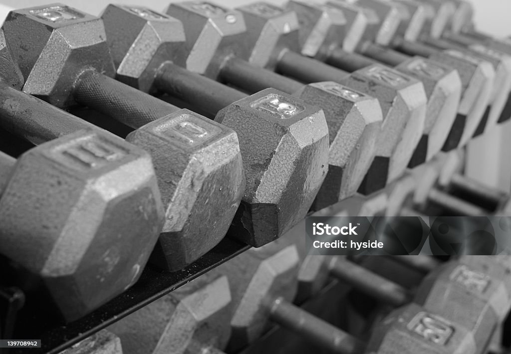 Rack of Free Weight Dumbells Grayscale rack of freeweight dumbells of progressively higher weights. Anaerobic Exercise Stock Photo