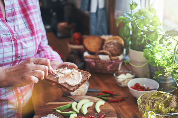 istock Preparing Avocado Sandwich with Brown Bread, Cottage Cheese and Chili 1397090062