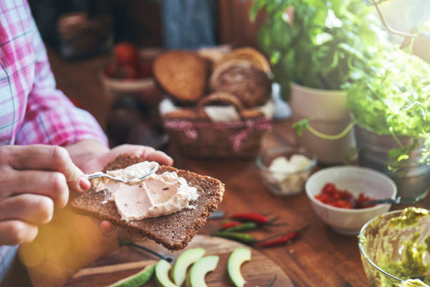istock Preparing Avocado Sandwich with Brown Bread, Cottage Cheese and Chili 1397090122