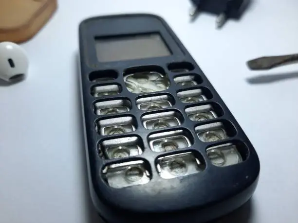 old nokia cellphone with broken keyboard.