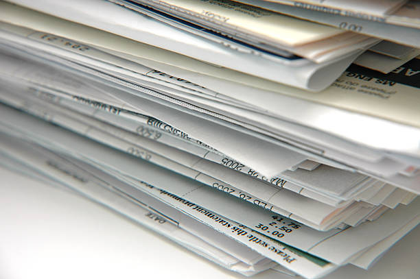 Bills and Invoices Stack of Bills and Invoices banking document stock pictures, royalty-free photos & images