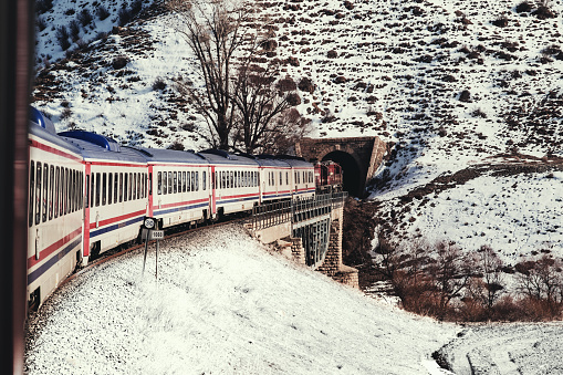 Erzincan, Turkey - February 22, 2022: Eastern express train and the train is about to enter the tunnel.