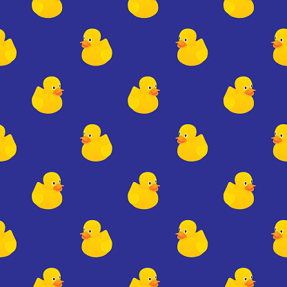 Vector seamless pattern of cute little rubber ducks on a dark blue background.rubber duck