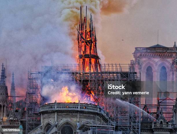 A Fireman Alone Against A Huge Fire Stock Photo - Download Image Now - Notre Dame de Paris, Fire - Natural Phenomenon, Burning
