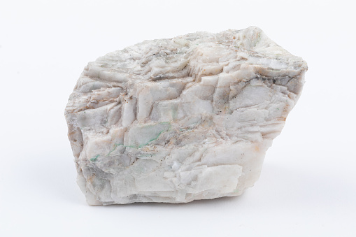 rough calcite rock cutout on white background
