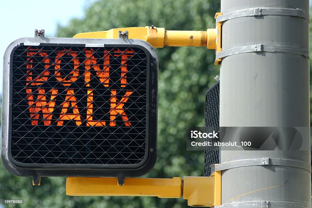 Close up Don't Walk sign on a clear day  Don't walk Sign. Don't Walk Signal Stock Photo