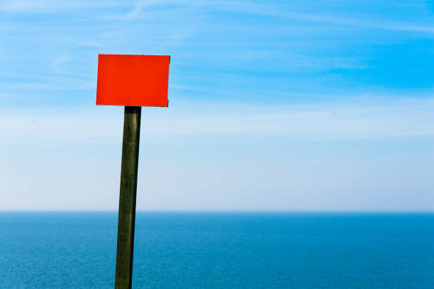 istock Blank warning signage near sea coast cliff 1397103828