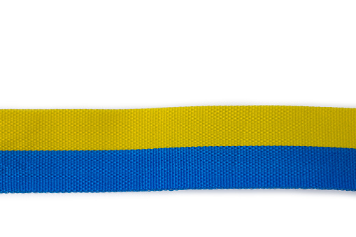 Close up view of Ukrainian flag symbols, ribbons isolated on white background. Sweden.