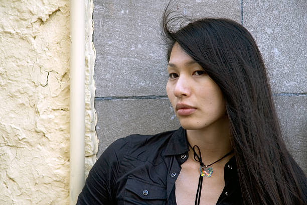 istock asian girl against wall 139710695