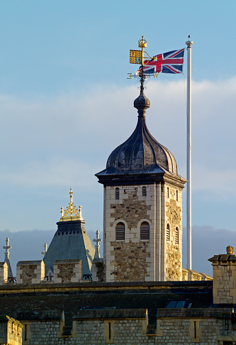 Tower of London detail, with the Royal Standard and Union Flag.  Focus on Royal Standard and Union Jack.