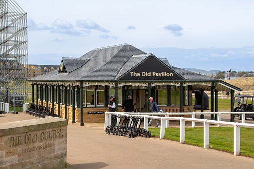 St. Andrews, Scotland, United Kingdom - April 28, 2022: View of the Old Pavilion near the 18th fairway of the Royal and Ancient Gold Club of St Andrews (old course). St Andrews is the oldest golf course in existence.