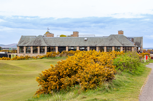St. Andrews, Scotland, United Kingdom - April 28, 2022: View of the St Andrews Links Clubhouse at the Royal and Ancient Gold Club of St Andrews. St Andrews is the oldest golf course in existence.