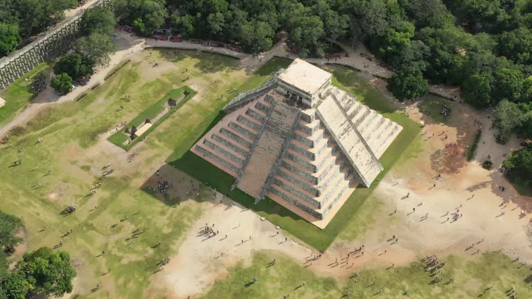 Chichen Itza, Mexico: Aerial view of ancient Mayan city, mesoamerican pyramid El Castillo (Temple of Kukulkan) surrounded by lush jungle - landscape panorama of Yucatan Peninsula from above, America