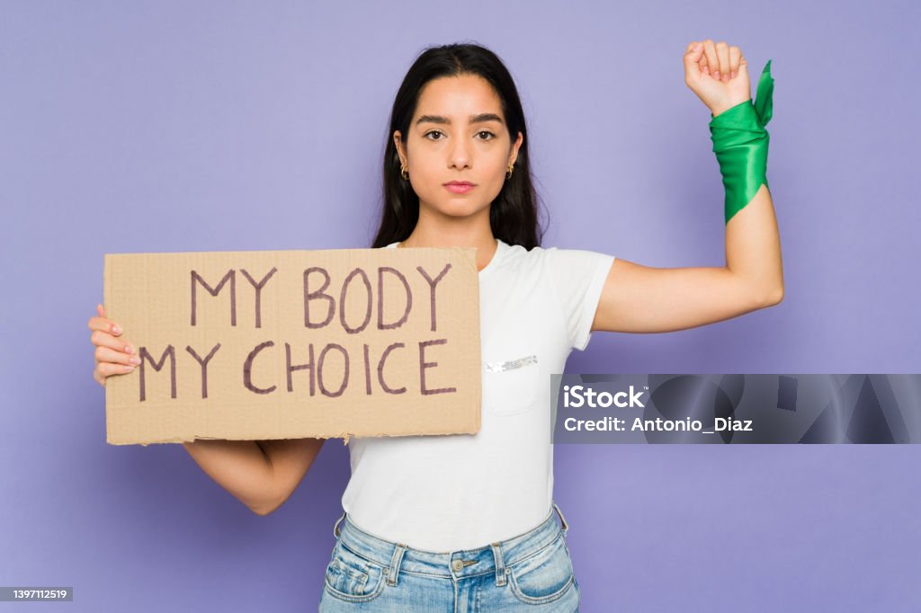 Feminist woman in favor of abortion My body my choice message. Pro choice young woman asking to legalize abortion during a feminist protest Abortion Stock Photo