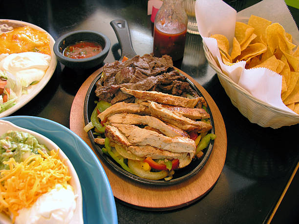 A restaurant table full of Mexican food
