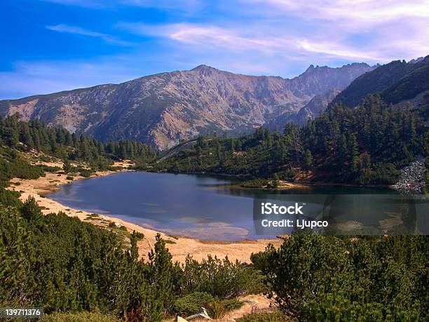Glacial Lake With Some Mountains In The Background Stock Photo - Download Image Now - Agricultural Field, Beach, Beauty