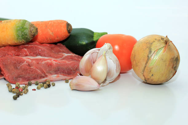 Raw meat and vegetables stock photo
