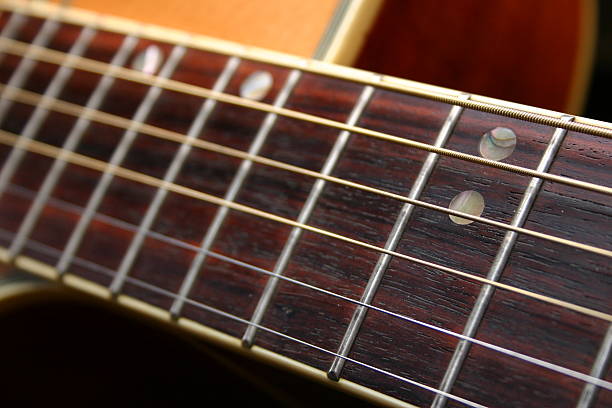 Acoustic guitar - 12th fret stock photo