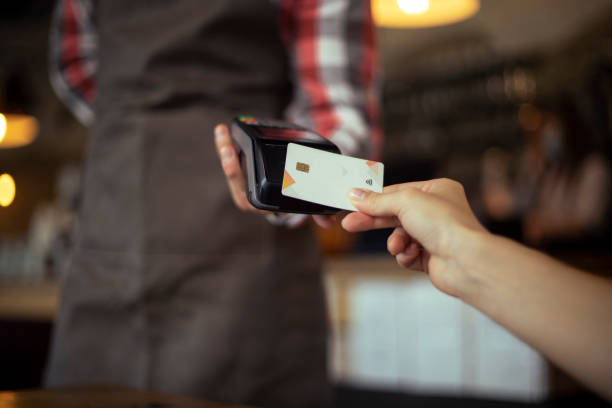 istock A young unrecognizable woman makes contactless payment. 1397116073