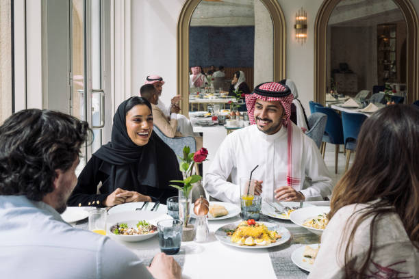 istock Two young Riyadh couples having lunch at hotel restaurant 1397116176