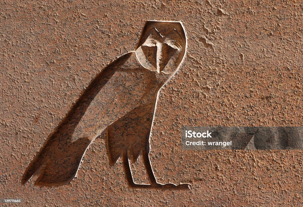 Egyptian Eagle Owl An Egyptian Hieroglyph in the shape of on eagle owl on an obelisk in the Temple of Amun in Karnak near Luxor (Thebes), Egypt. Africa Stock Photo