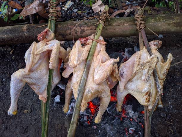 istock Making grilled chicken over coals in a close-up photo 1397118215