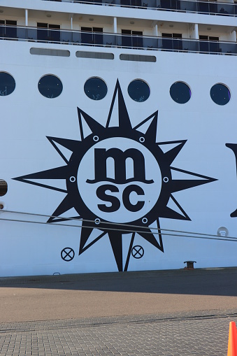 IJmuiden, The Netherlands - March 4th 2022: MSC Magnifica at Felison Cruise terminal IJmuiden, company logo. Compass with MSC logo
