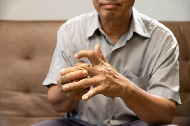 istock Senior man hand suffering from joint pain with gout inflammation 1397123897
