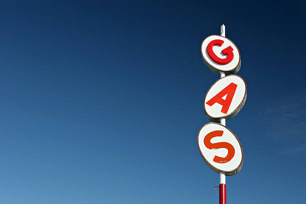 istock White and red retro gas sign against a blue sky background 139712579