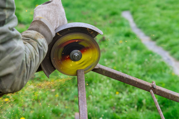 Metal processing with angle grinder sparks in metalworking works on production