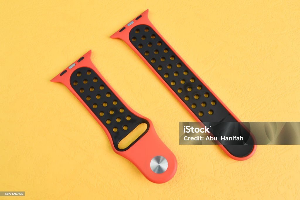 Klang, Malaysia: September 6, 2021- Apple Watch straps isolated on e yellow background Klang, Malaysia: September 6, 2021- Apple watch straps isolated on a yellow background Clock Stock Photo