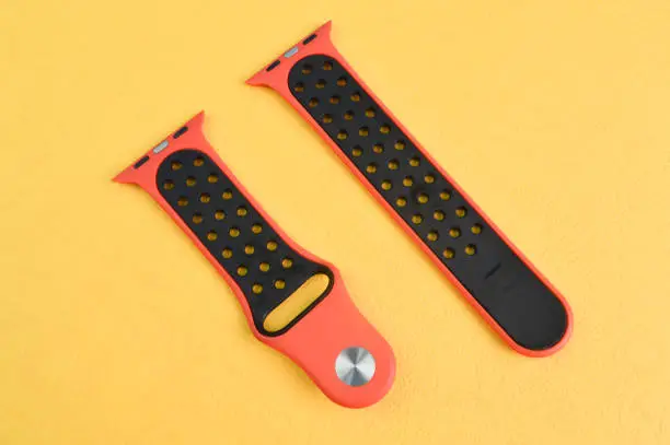 Photo of Klang, Malaysia: September 6, 2021- Apple Watch straps isolated on e yellow background