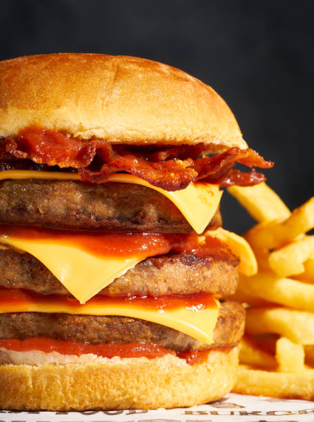 istock Hamburger with bacon cheddar and french fries 1397128573