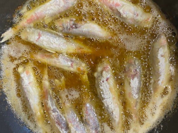 istock Frying mullet fish in hot sunflower oil 1397133512