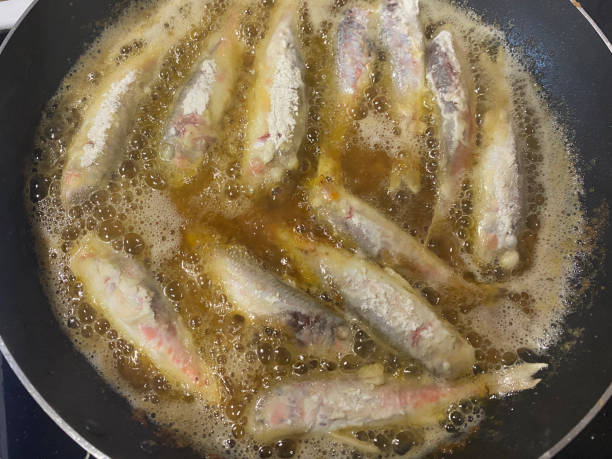 istock Frying mullet fish in hot sunflower oil 1397134145