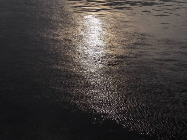 istock indigo silver water and golden yellow light 1397134894
