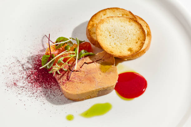 istock Chicken liver pate with toasted bread and jam isolated on white background. Meat terrine with citrus and toast. Restaurant food - duck pate with baguette on white plate. Meat appetizer. 1397135063