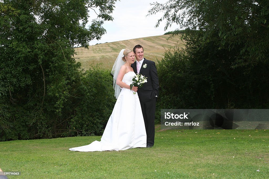 The Bride and Groom The bride and groom pose after the wedding Adult Stock Photo